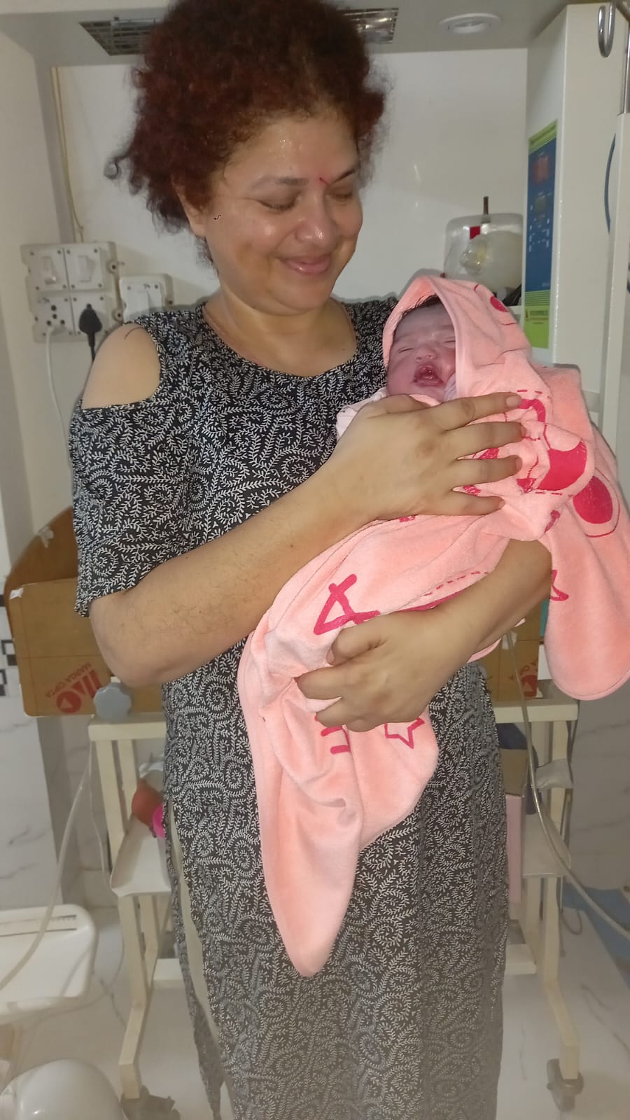 Happy mother with baby girl from surrogacy