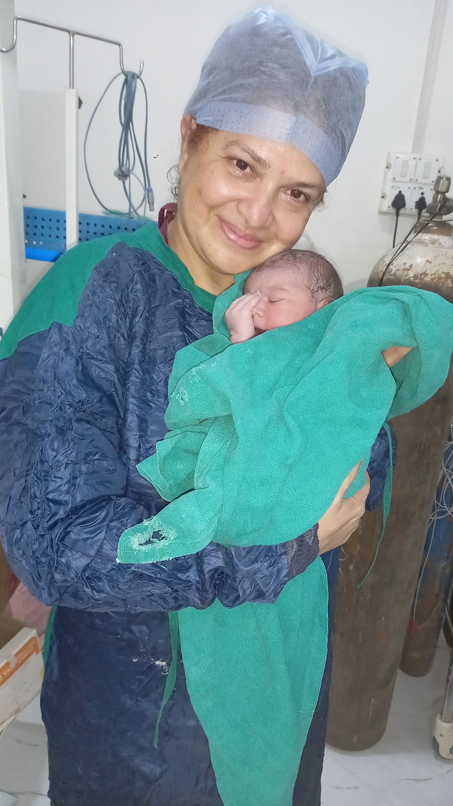 Doctor with healthy newborn baby
