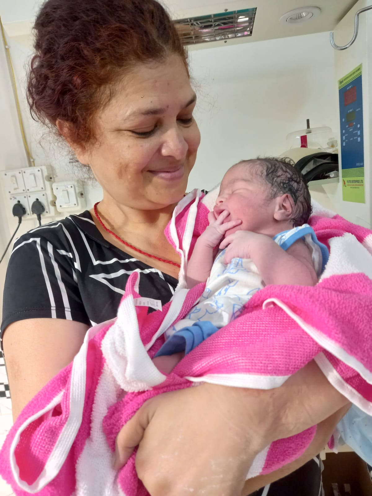 New mother smiling with baby